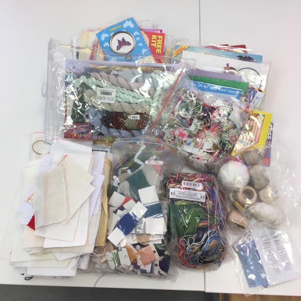 Bag 29 - 2.5kg Cross stitch bundle. Cross stitch fabric, threads on bobbins, loose threads, embroidery scraps for embellishment and free cross-stitch kits. 2.450kg