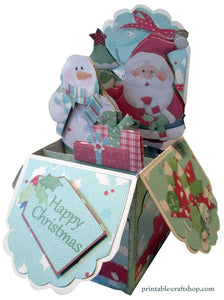 A festive pop-up box card with Santa, a snowman, and presents